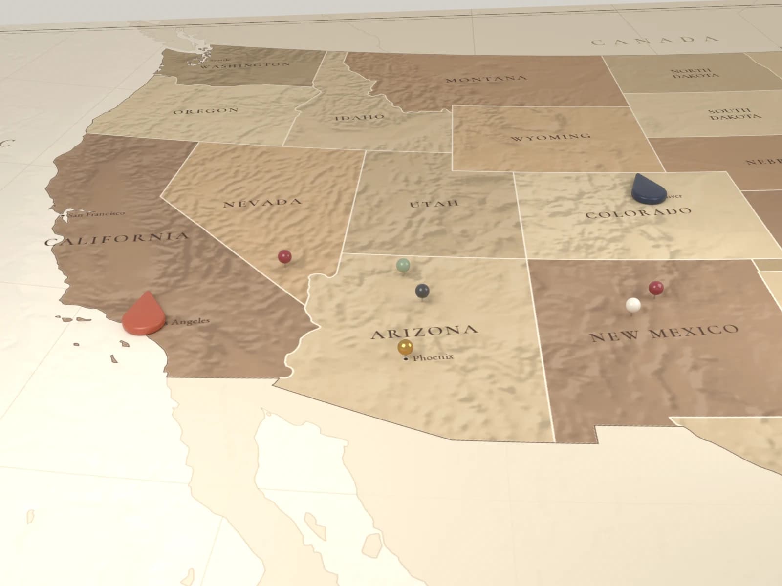 A framed Saddle-style United States map with Smart Pins at Los Angeles and Denver and round route pins along the road between them