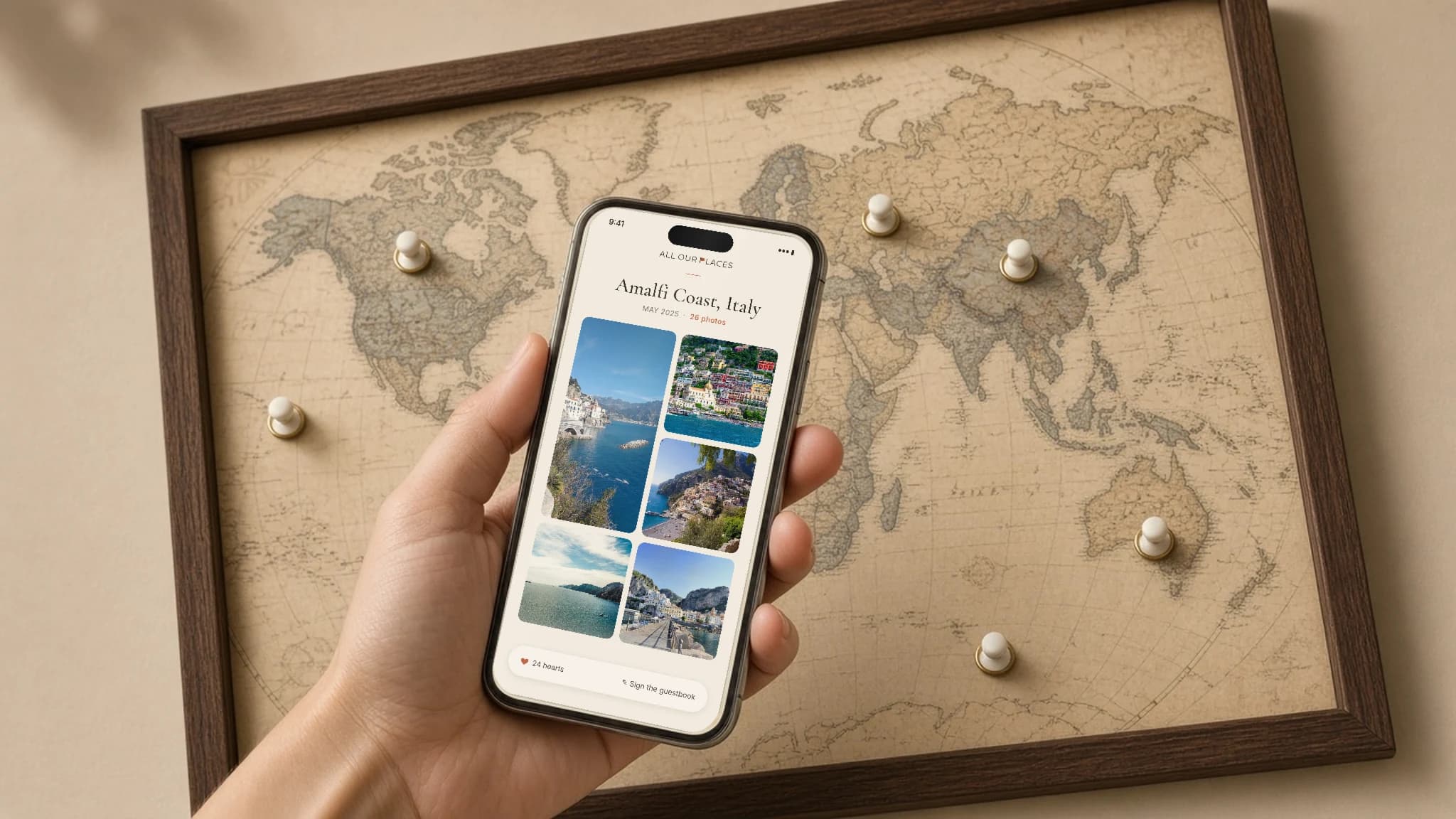 Phone showing the Grand Canyon gallery beside a framed Saddle-style world map